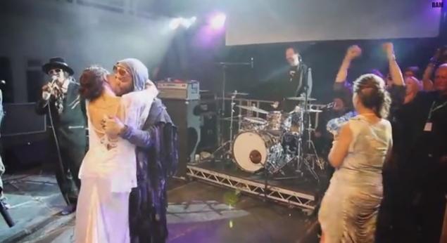 The crowd at the Random Hero Festival give the newlyweds a standing ovation.